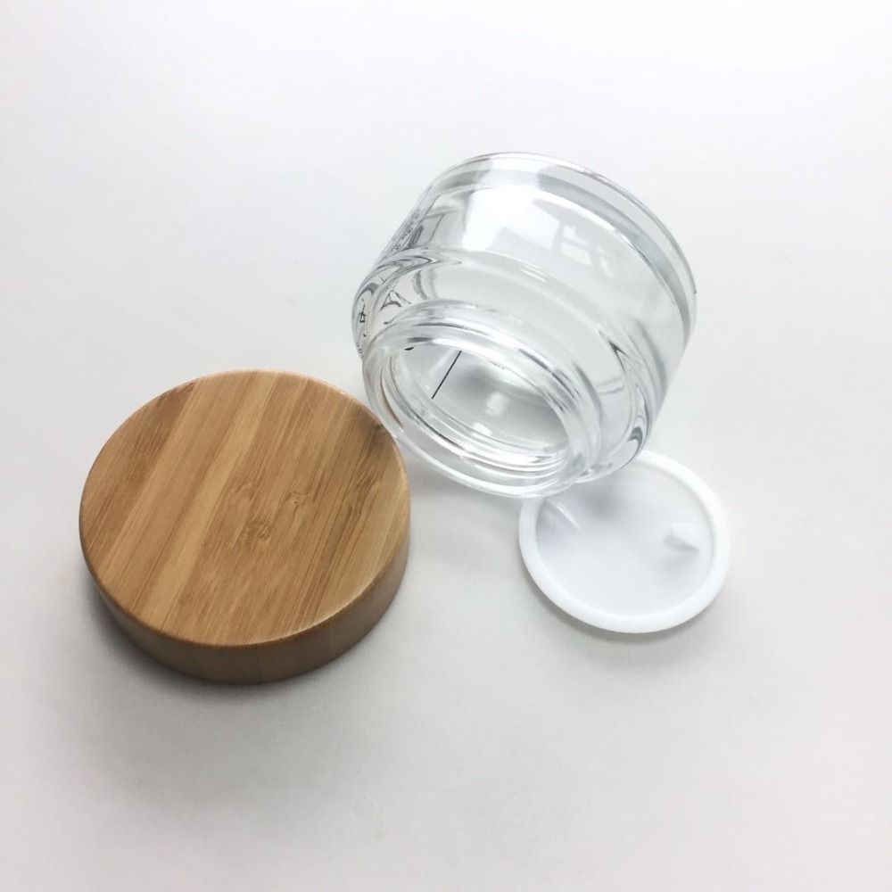 OEM ODM engraved printing logo Cosmetic 5ml 15ml 30ml 50ml 100ml clear frosted glass jar with bamboo wooden lid for body cream