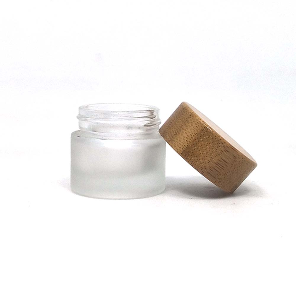 OEM ODM engraved printing logo Cosmetic clear frosted glass jar with bamboo wood cover for body cream