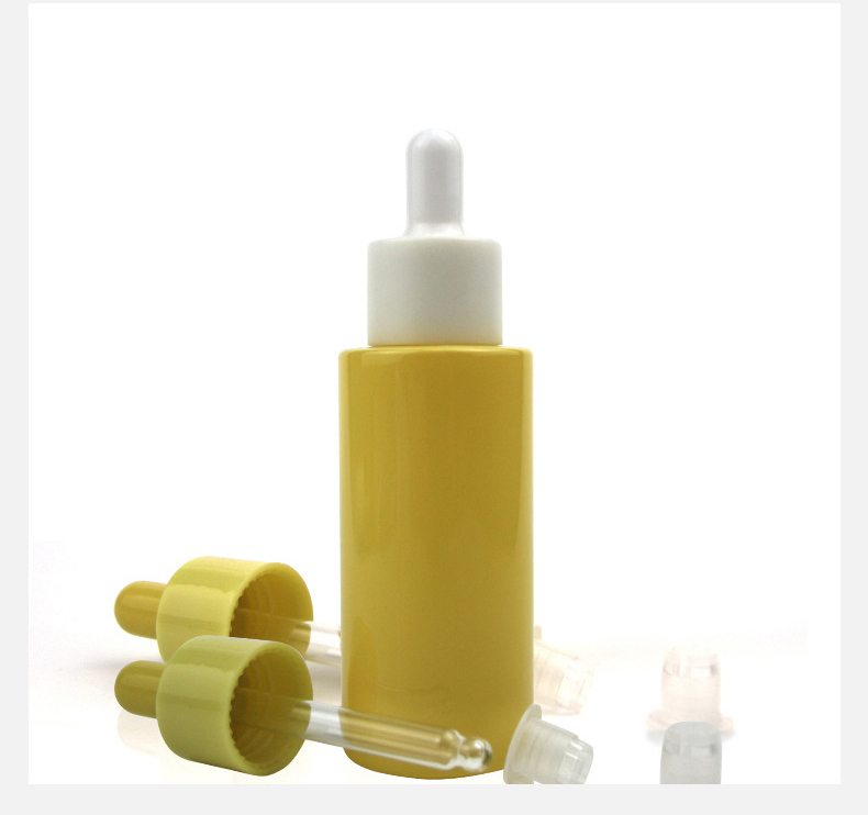 OEM Skin care packaging bottles custom yellow color flat shoulder oil dropper bottle 30ml glass bottle with gold dropper