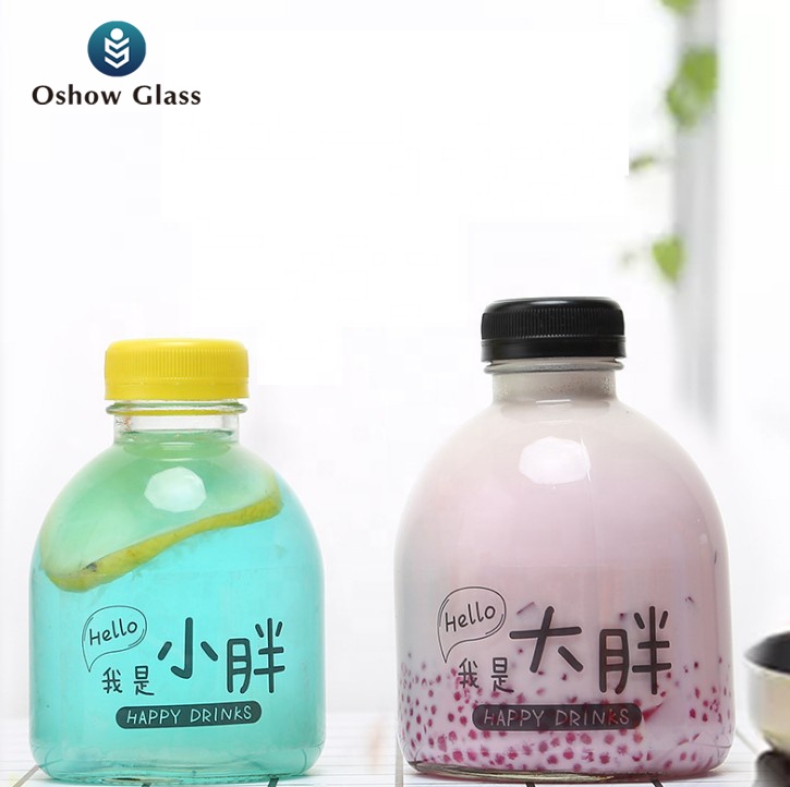 OSHOW 300ml 500ml new design round glass beverage bottle for juice coffee milk wine with lid