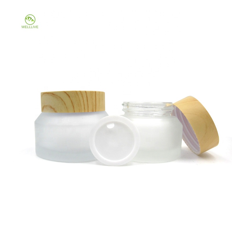 Oblique shoulder 15g 30g 50g frosted clear glass jar with wood grain cap for cosmetic ointment packaging