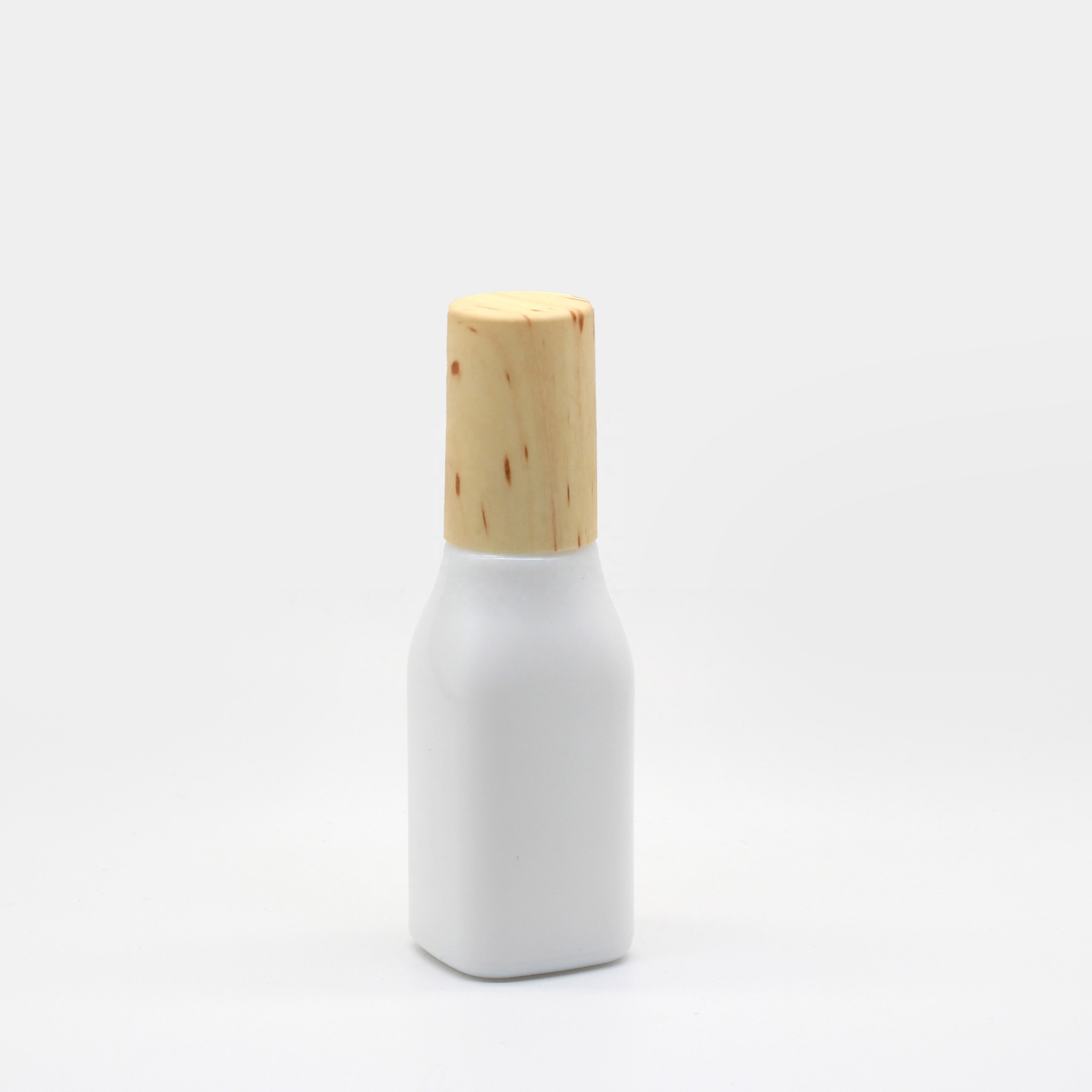 Opal glass cosmetic jar and bottle with wooden color lid and pump