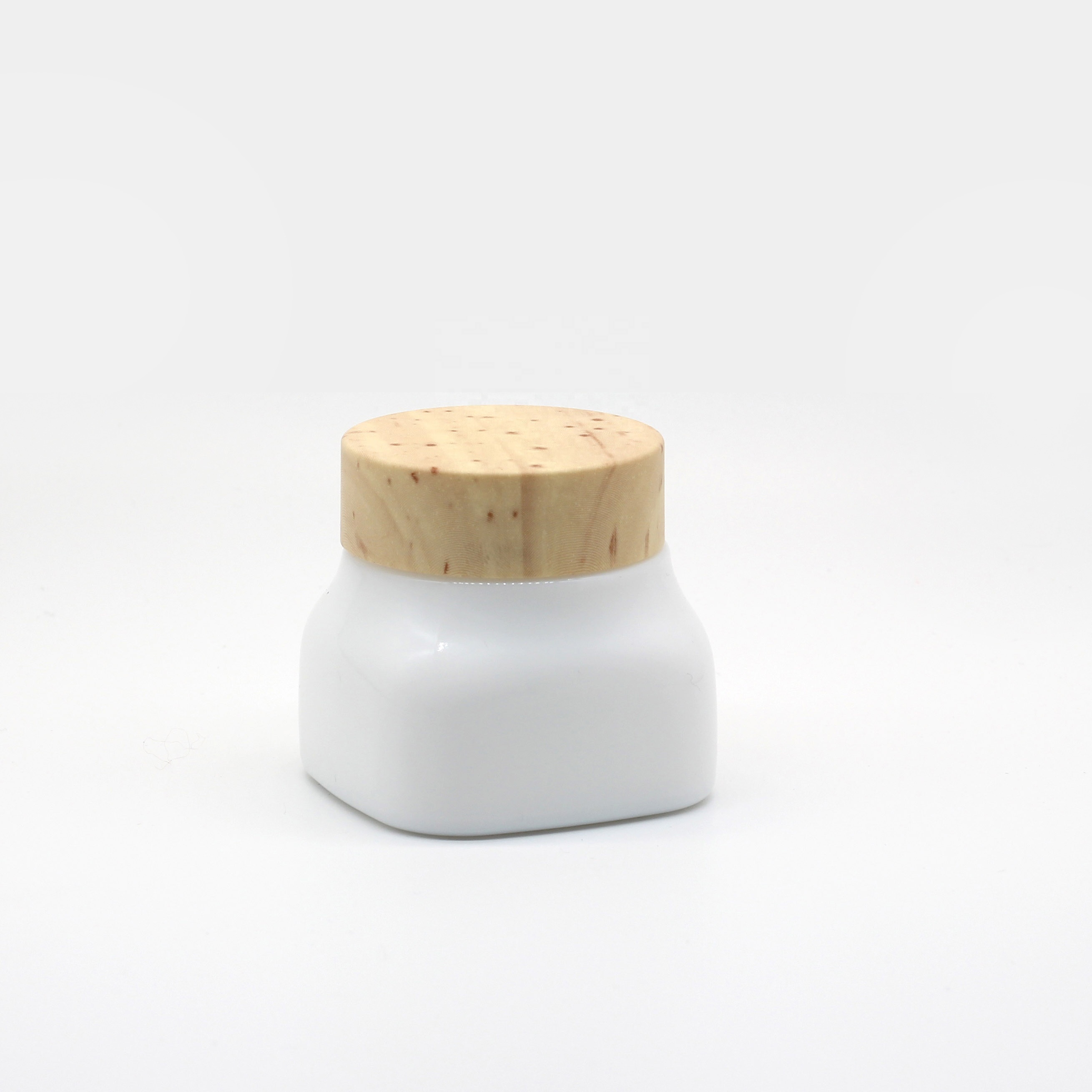 Opal glass cosmetic jar and bottle with wooden color lid and pump