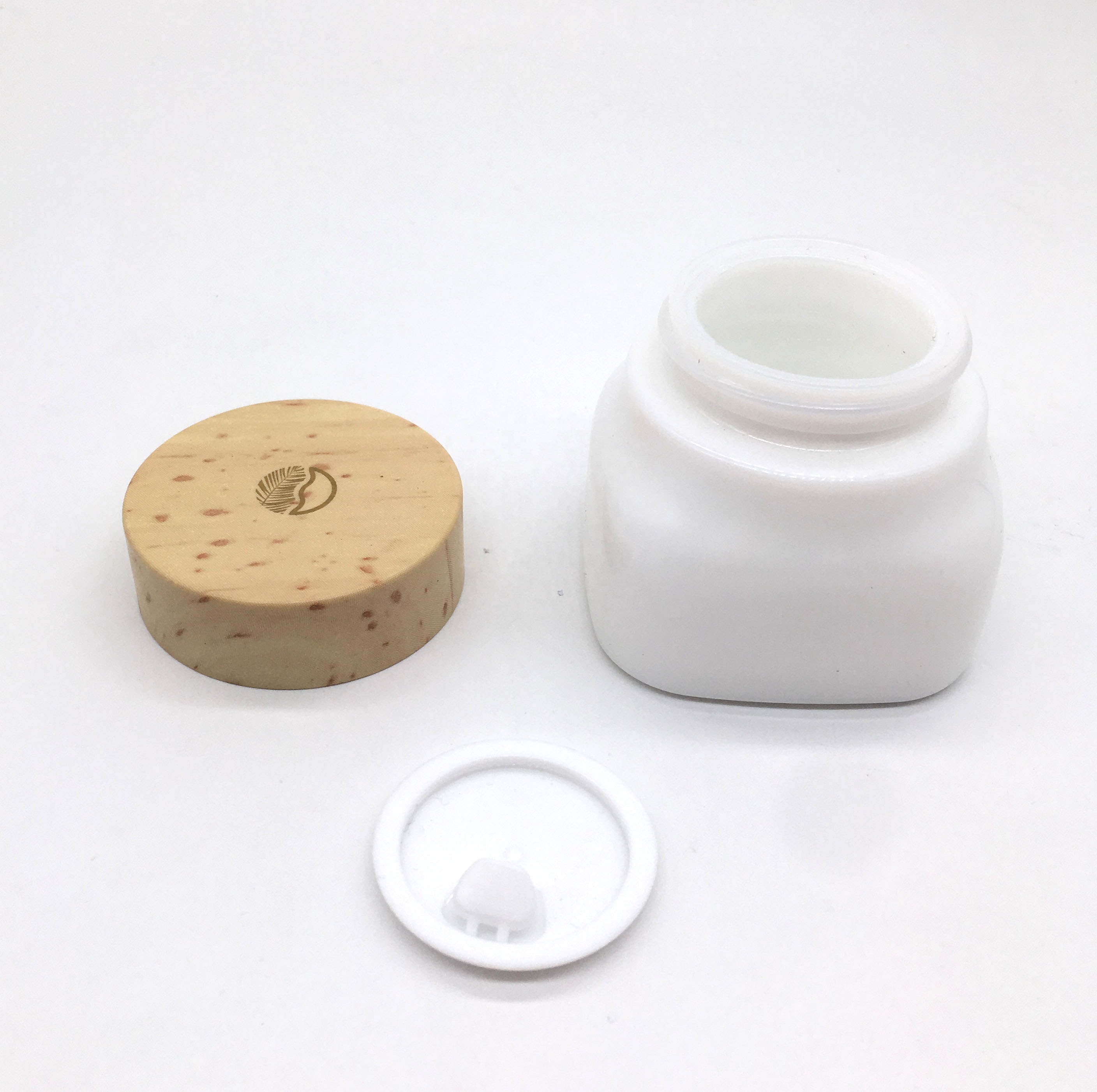 Opal glass cosmetic jar and bottle with wooden color lid and pump