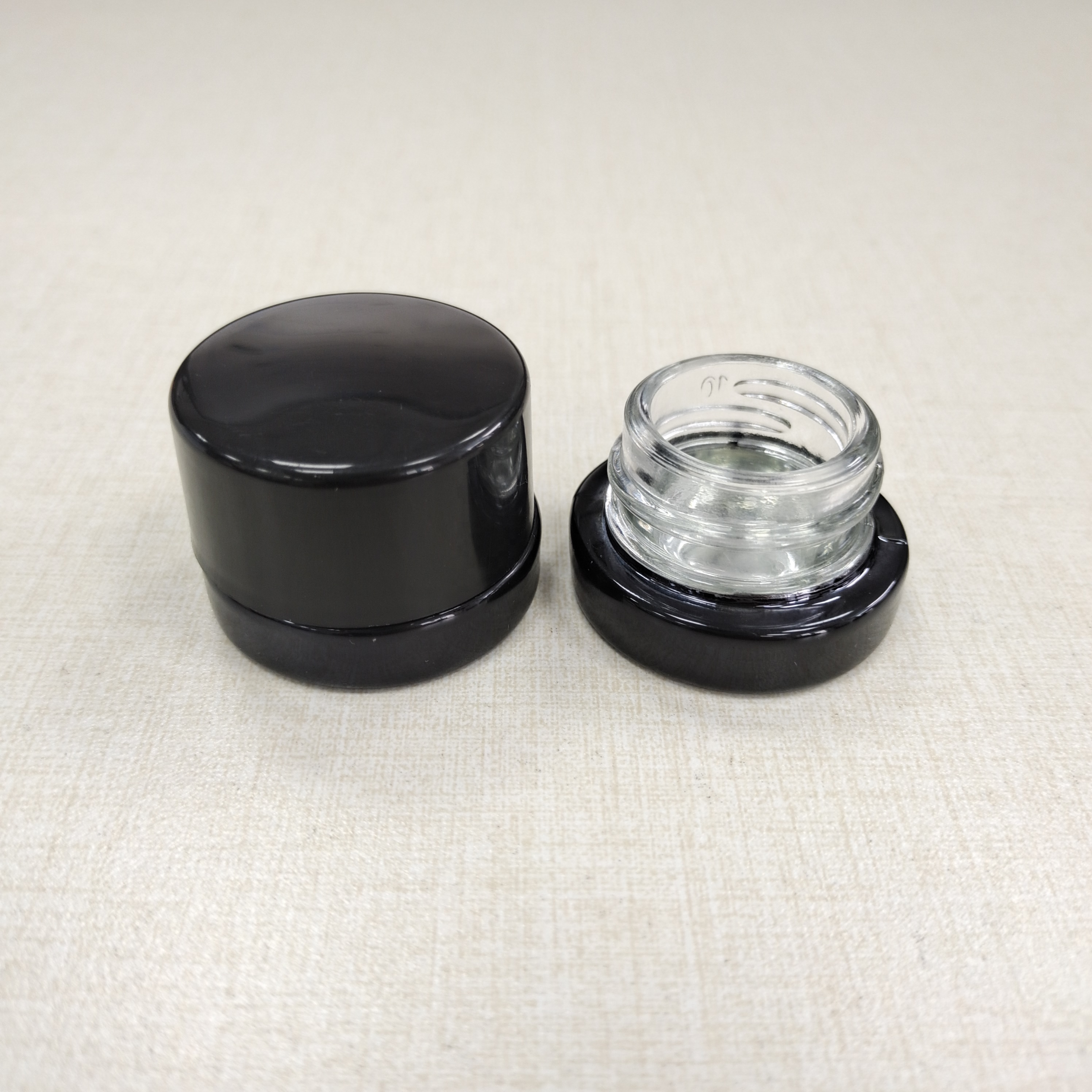 Painted black 5ml glass cosmetics jar with child resistant black cap
