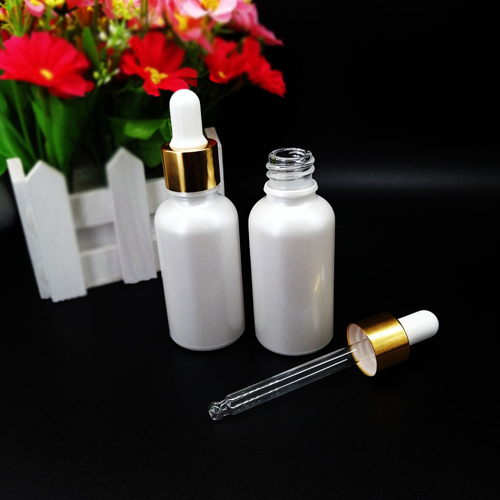 Pearlescent white glass dropper bottle 30ml cosmetic essential oil packaging container with gold lid and silicone top