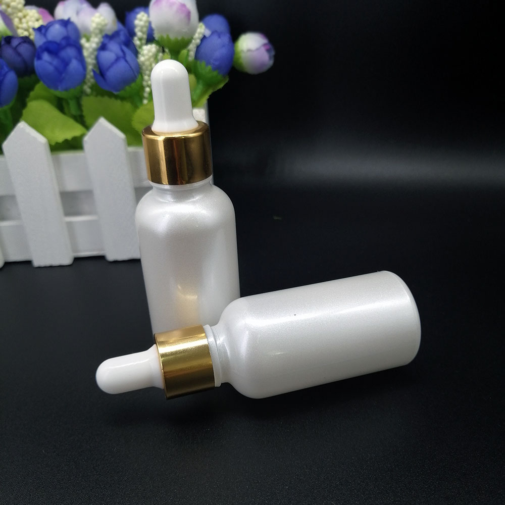 Pearlescent white glass dropper bottle 30ml cosmetic essential oil packaging container with gold lid and silicone top