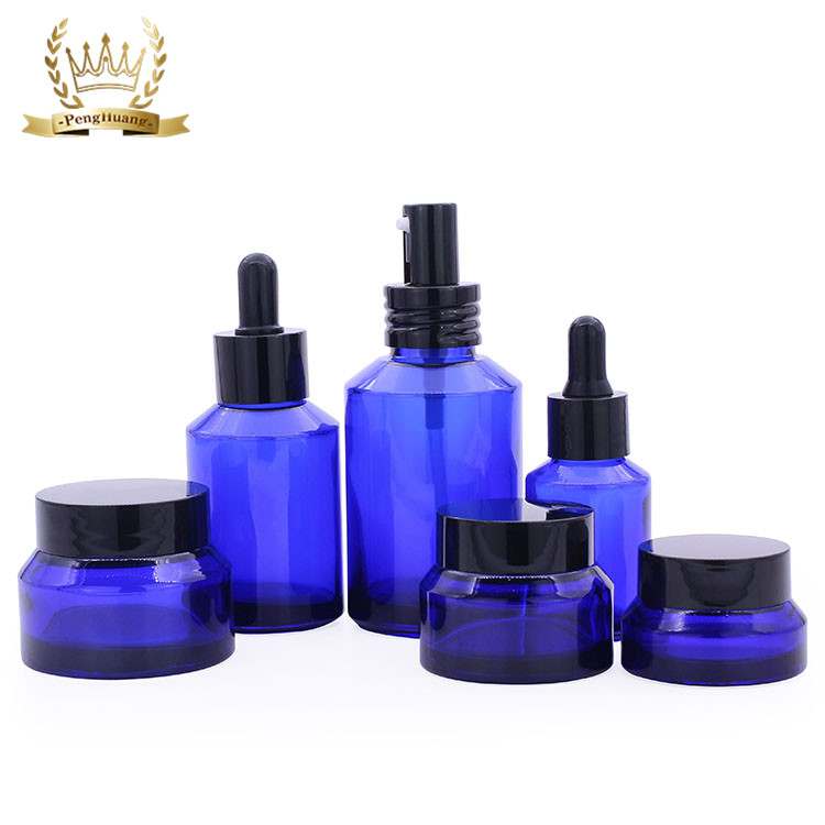 Penghuang Glass Cosmetic Bottle Set Unique Cosmetic Cream Packaging Bottle Amber Glass Jar With Lid