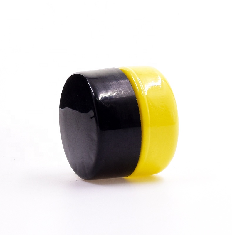 Popular 10 ml yellow round straight side eye cream cosmetic packing glass jar with plastic child proof lid.