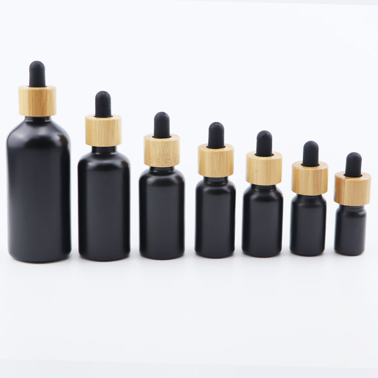 Popular 10ml 15ml 20ml 30ml 50ml 100ml euro round matte black glass dropper bottle with bamboo cap