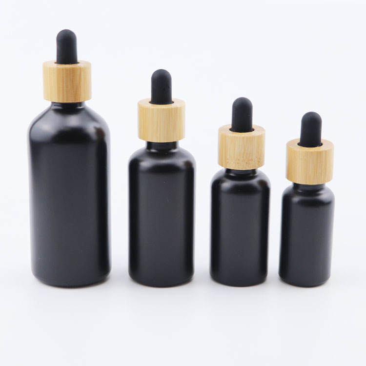 Popular 10ml 15ml 20ml 30ml 50ml 100ml euro round matte black glass dropper bottle with bamboo cap