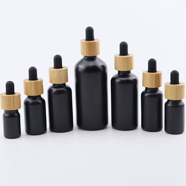 Popular 10ml 15ml 20ml 30ml 50ml 100ml euro round matte black glass dropper bottle with bamboo cap