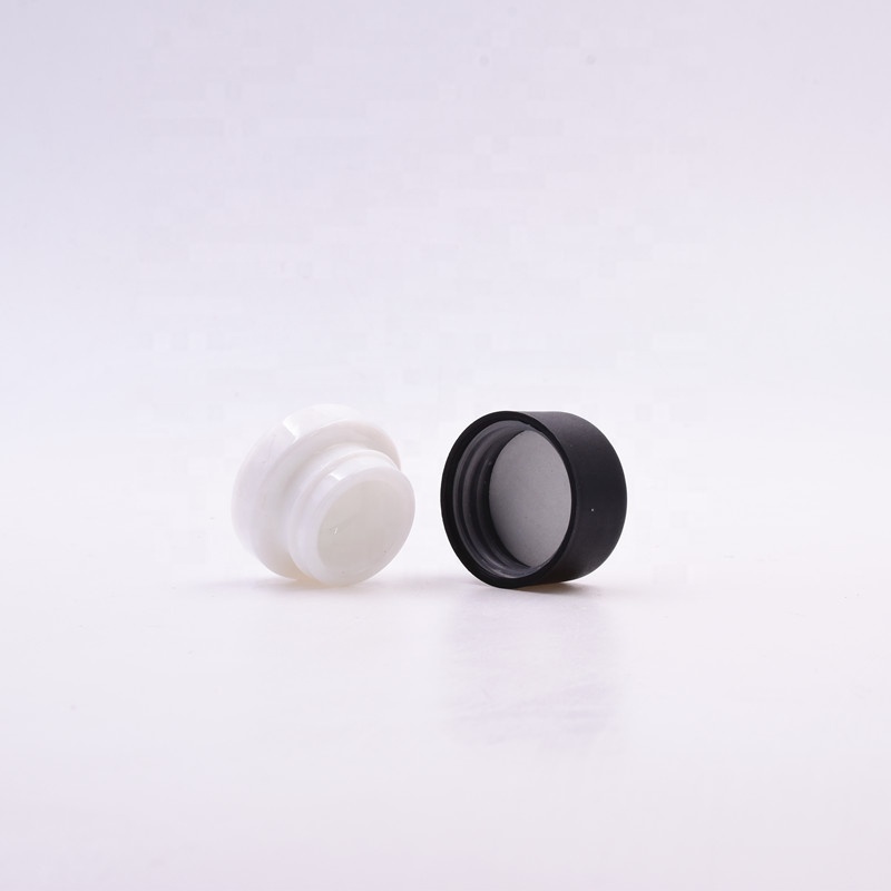 Popular 3 ml white round small straight side eye cream cosmetic packing glass jar with black plastic child proof lid.