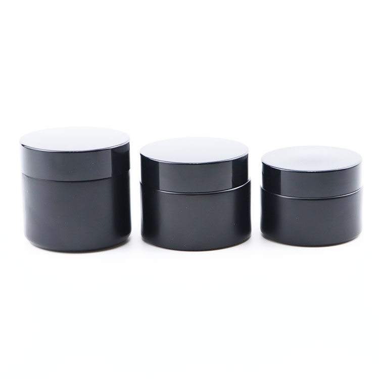 Popular 30g 50g 60g black frosted glass cosmetic packaging skincare cream jars with black lids round glass jars 2 ounce