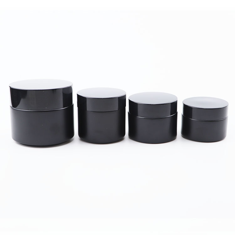 Popular 30g 50g 60g black frosted glass cosmetic packaging skincare cream jars with black lids round glass jars 2 ounce
