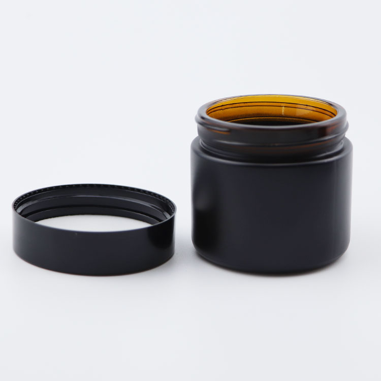 Popular 60g clear amber matte black glass cosmetic skincare cream jars with black lids 2oz