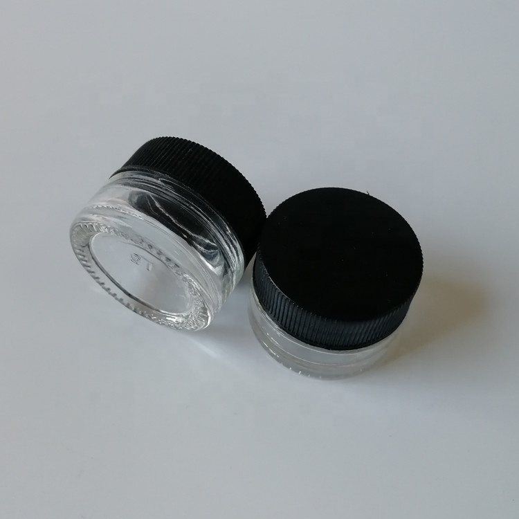 Popular Clear Glass Mini 3ml 5ml 7ml Skin Care Lotion Eye Cream Glass Jars with Black Smooth Child Resistant Lid