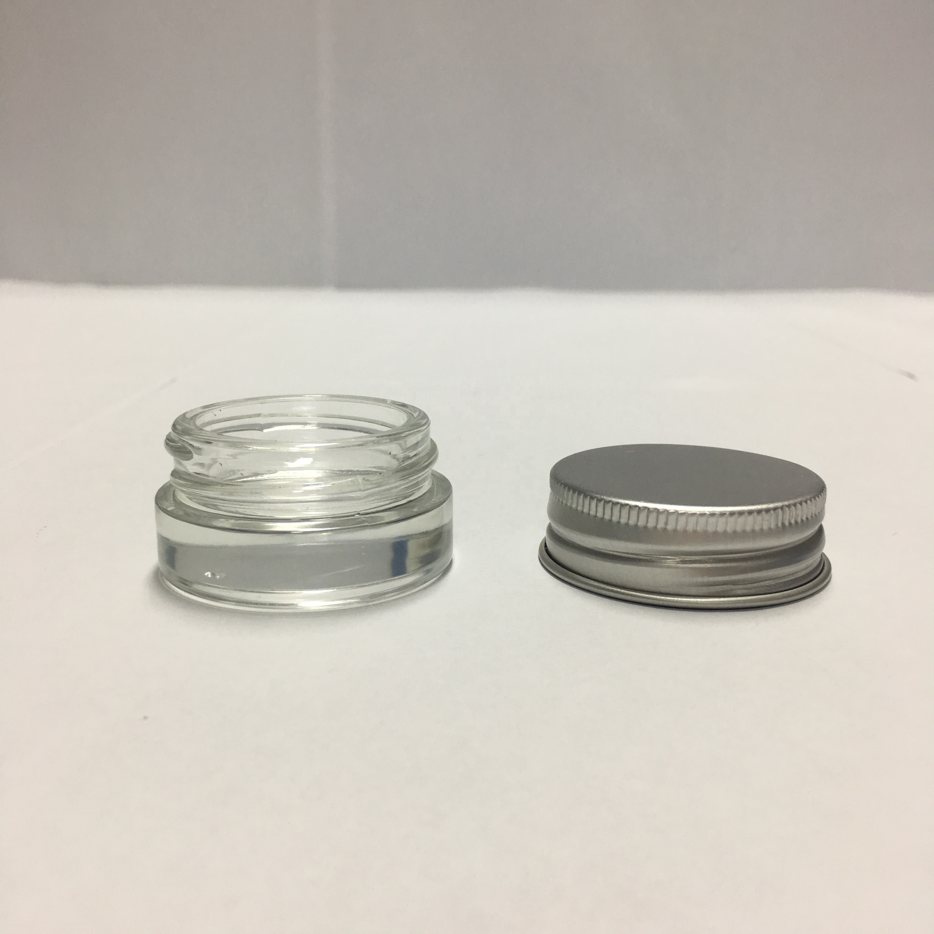 Popular Clear Glass Mini 5ml 6ml 7ml Skin Care Lotion Eye Cream Glass Jars with aluminum metal cap
