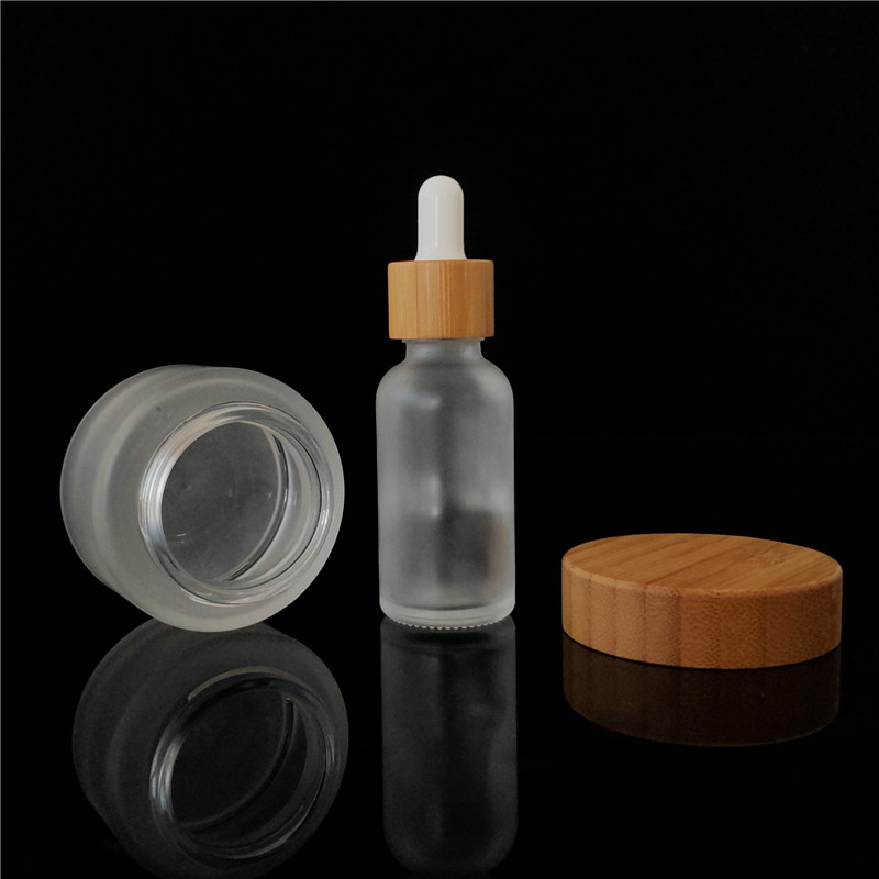 Popular cosmetic packing clear frosted 15ml bamboo 1oz cosmetic jar containers