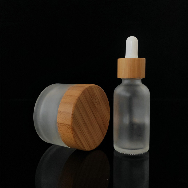 Popular cosmetic packing clear frosted 15ml bamboo 1oz cosmetic jar containers