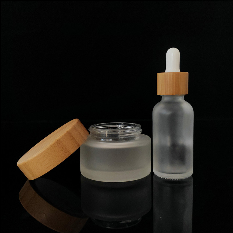 Popular cosmetic packing clear frosted 15ml bamboo 1oz cosmetic jar containers