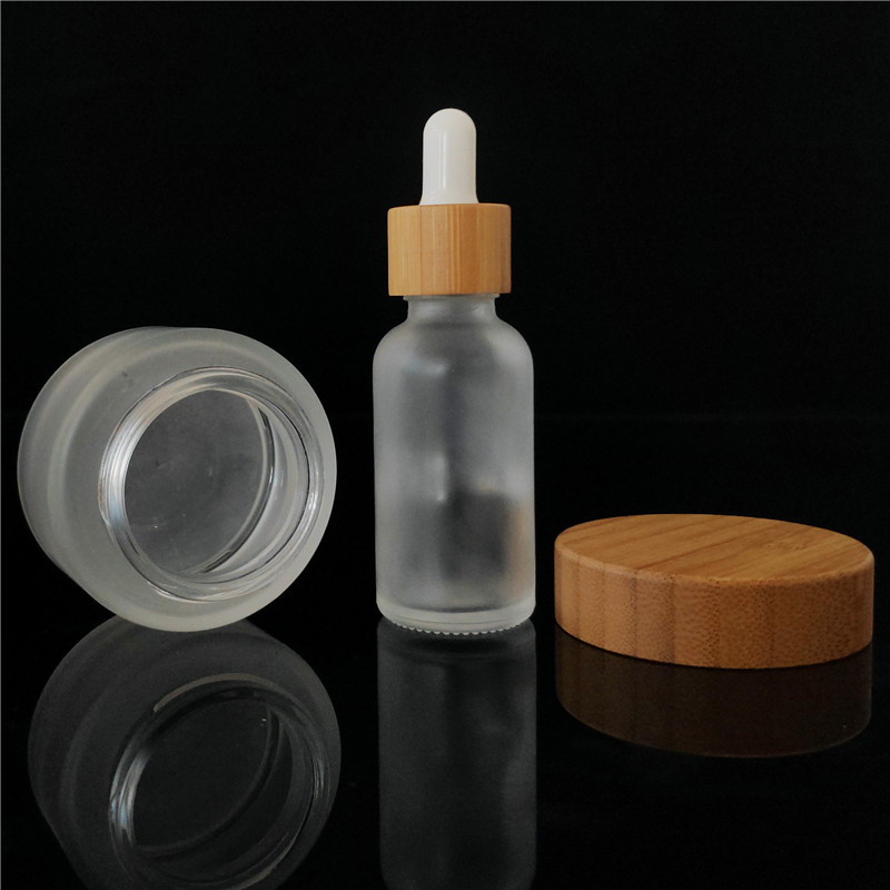 Popular cosmetic packing clear frosted 15ml bamboo 1oz cosmetic jar containers
