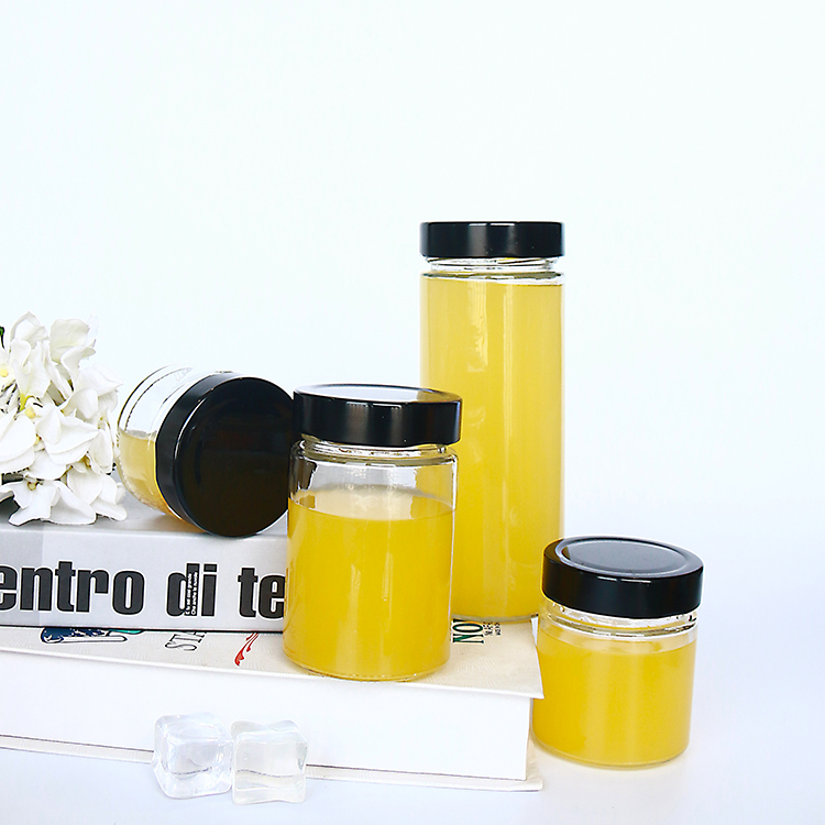 Popular hot sauce packaging 580ml round beverage bottle glass jars with deep lug lid