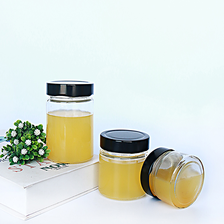 Popular hot sauce packaging 580ml round beverage bottle glass jars with deep lug lid