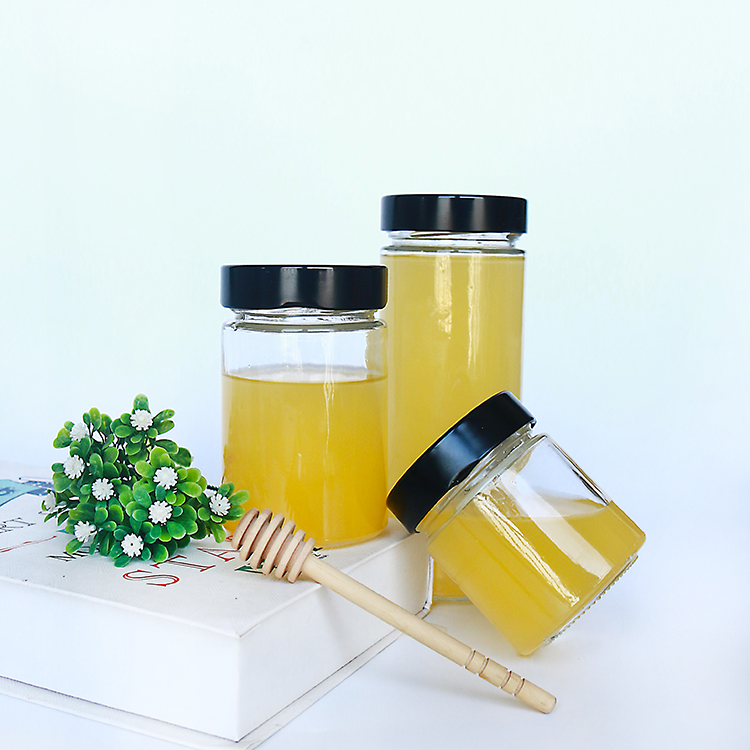 Popular hot sauce packaging 580ml round beverage bottle glass jars with deep lug lid