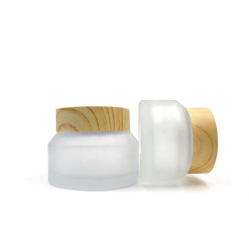 Portable travel size cosmetic jars 15g 30g 50g oblique shoulder transparent frosted matte glass cream jars with wood grain lid