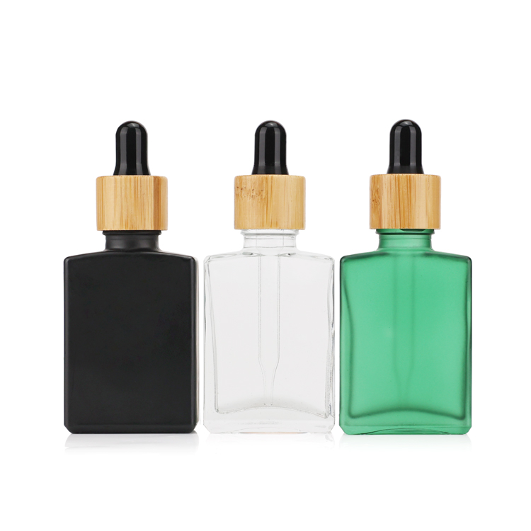 Premium black square essential oil packing 20ml 30ml 50ml glass dropper bottle with dark plastic cap for body care