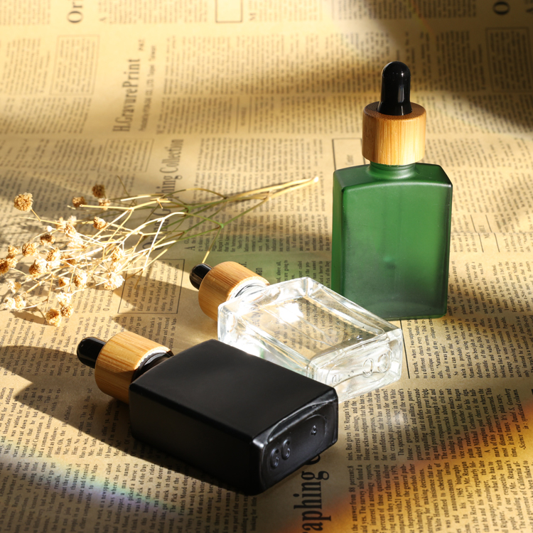 Premium black square essential oil packing 20ml 30ml 50ml glass dropper bottle with dark plastic cap for body care