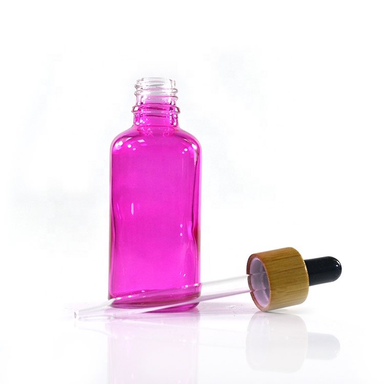 Premium brand new essential oil 10ml 15ml 20ml 30ml 50ml coating pink glass tincture bottle with bamboo dropper
