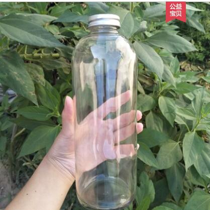 Promotional customized logo Glass drink wine bottle with lid