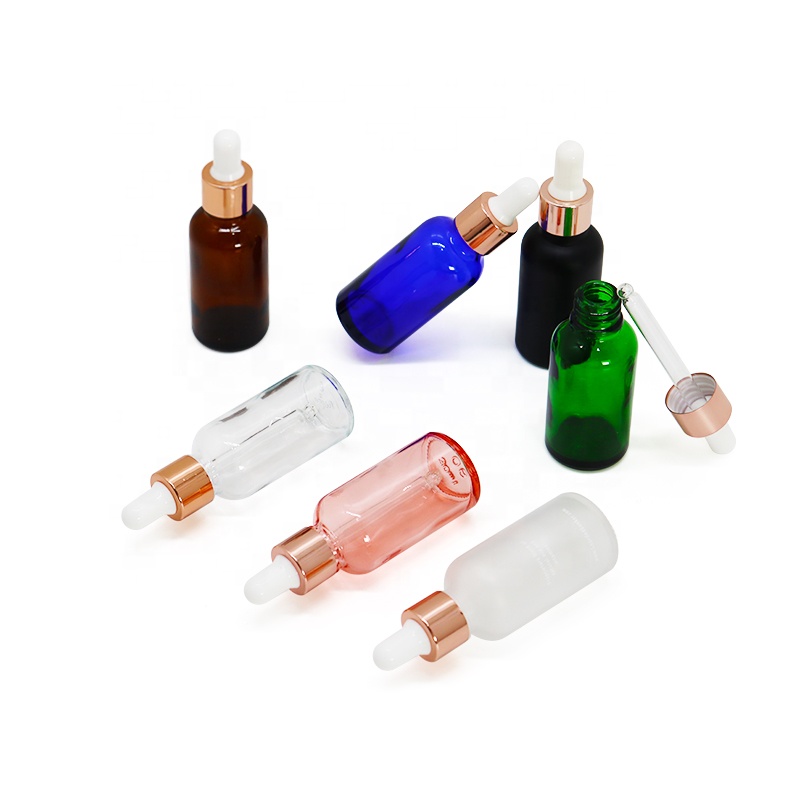 Rainbow 30ml round empty 1oz custom design essential oil glass dropper bottle with rose gold collar white rubber head