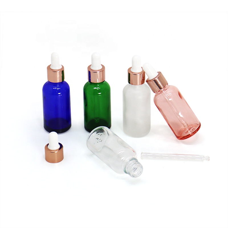 Rainbow 30ml round empty 1oz custom design essential oil glass dropper bottle with rose gold collar white rubber head
