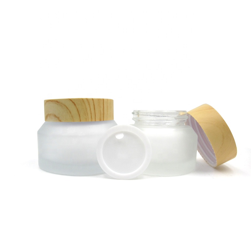 Refillable 15g 30g 50 g inclined shoulder frosted clear transparent glass jar with wooden lid for face eye cream packaging