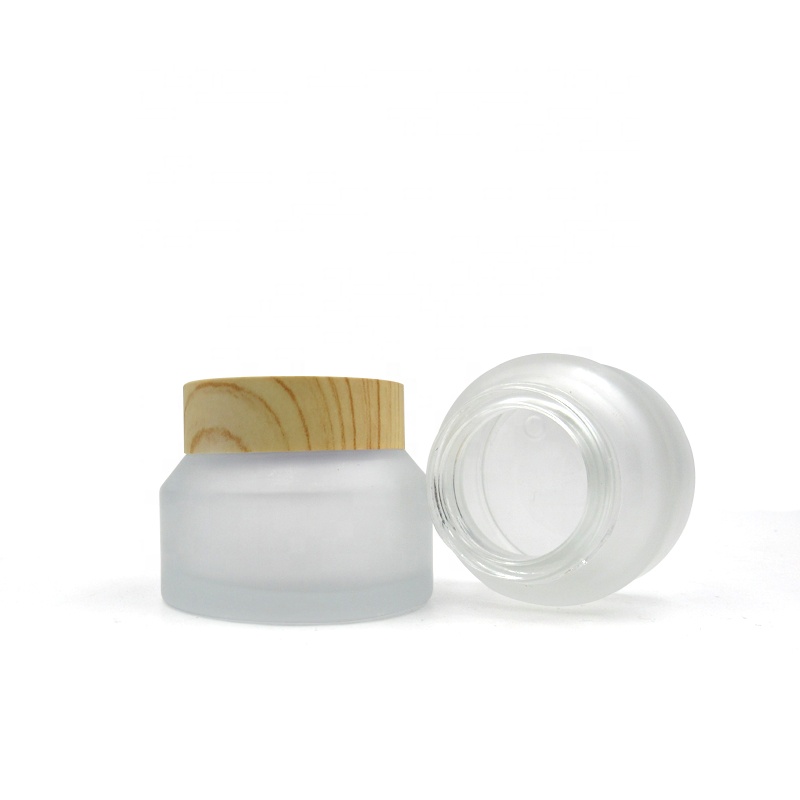 Refillable 15g 30g 50 g inclined shoulder frosted clear transparent glass jar with wooden lid for face eye cream packaging