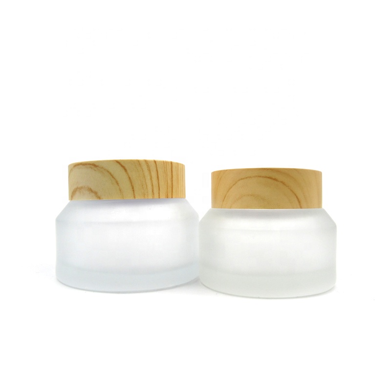 Refillable 15g 30g 50 g inclined shoulder frosted clear transparent glass jar with wooden lid for face eye cream packaging