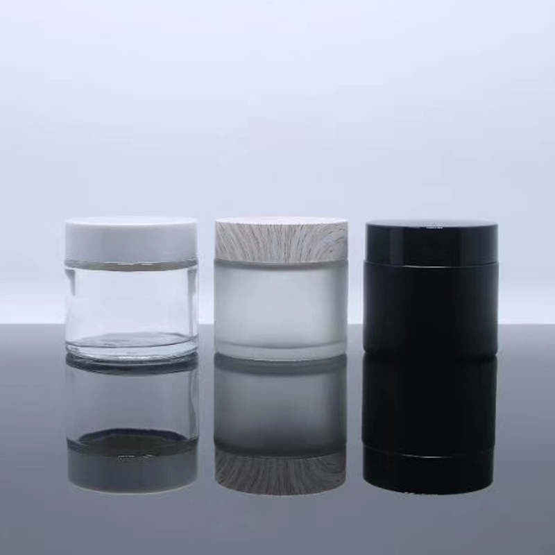 Round Clear Glass Cosmetic Packaging Face Skin Care Eye Cream Jar with Black Lid and Sealing Disc with custom colors