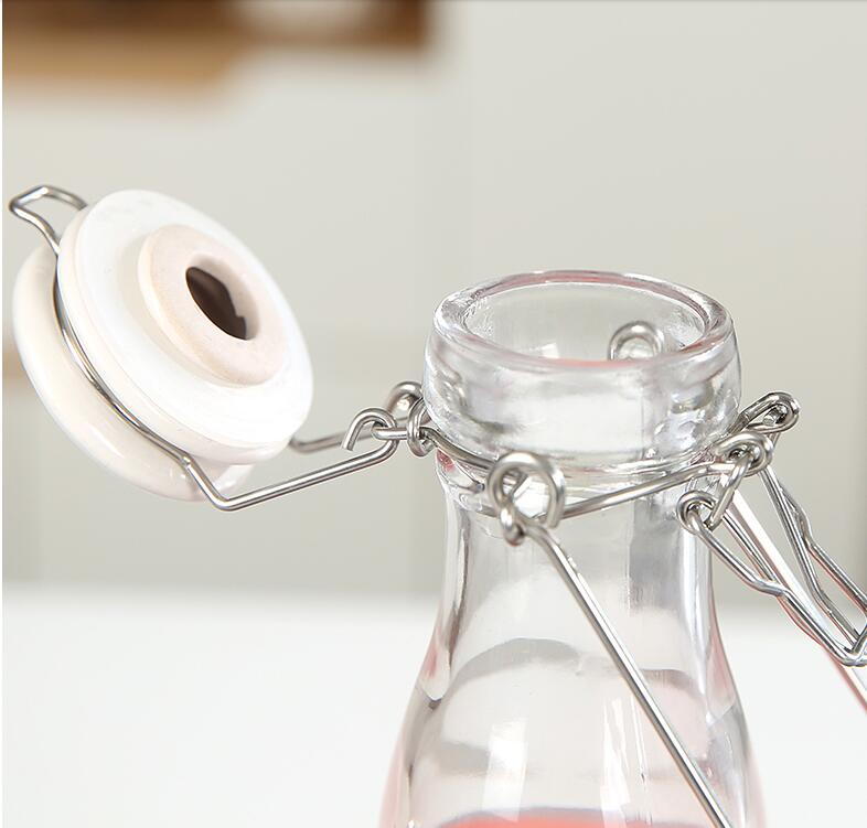 Round glass jar with buckle lock for honey jam honey fruit packaging glass jar stainless steel airtight lid