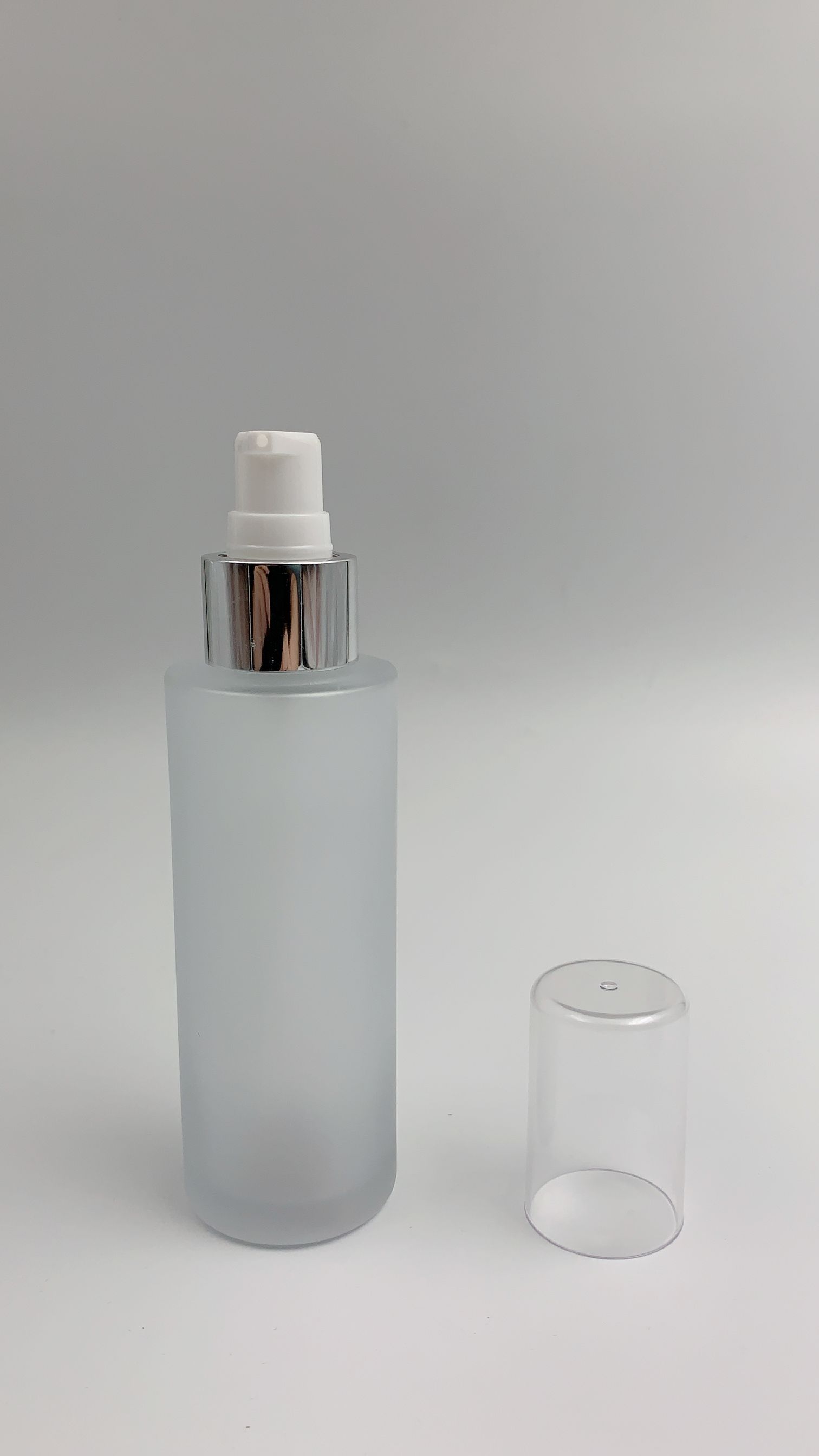 Round shape pump bottle 100ml skin care creams and serum pump glass bottles