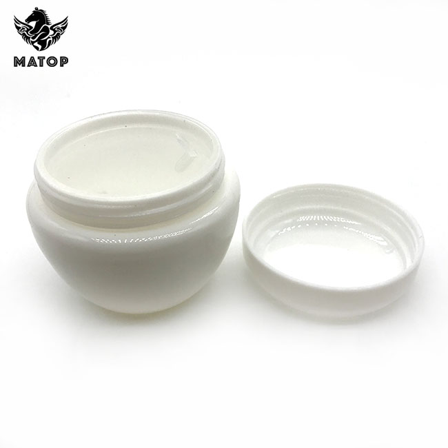 Round white plastic cosmetic jar with lid
