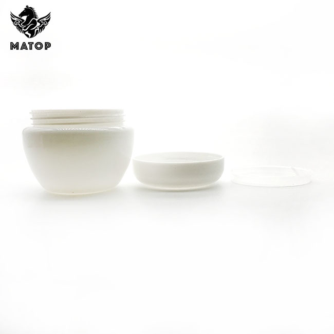 Round white plastic cosmetic jar with lid