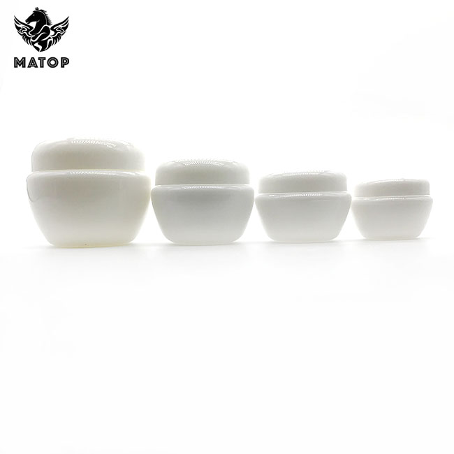 Round white plastic cosmetic jar with lid