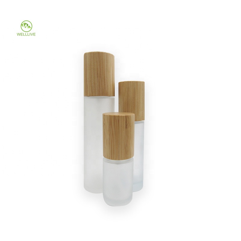 Screw top bamboo lid 50ml 60ml 2 oz frosted glass pump bottle for skincare