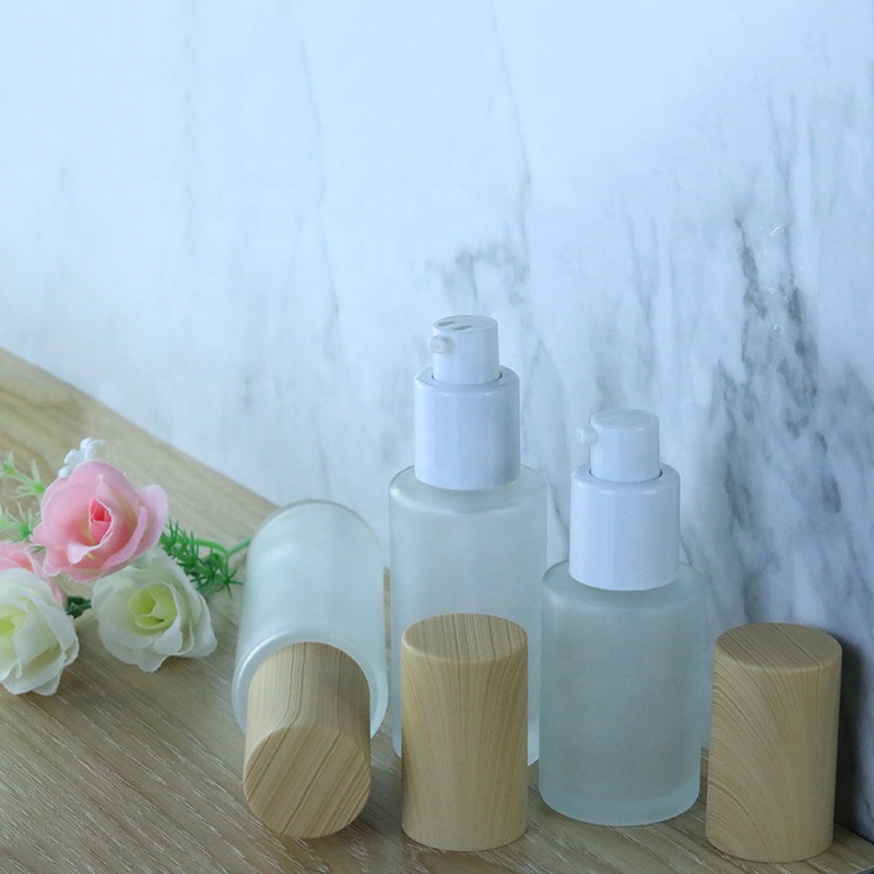 Skin care packaging 30ml 50ml 100ml flat round glass serum bottle with wood pump (EPG27)