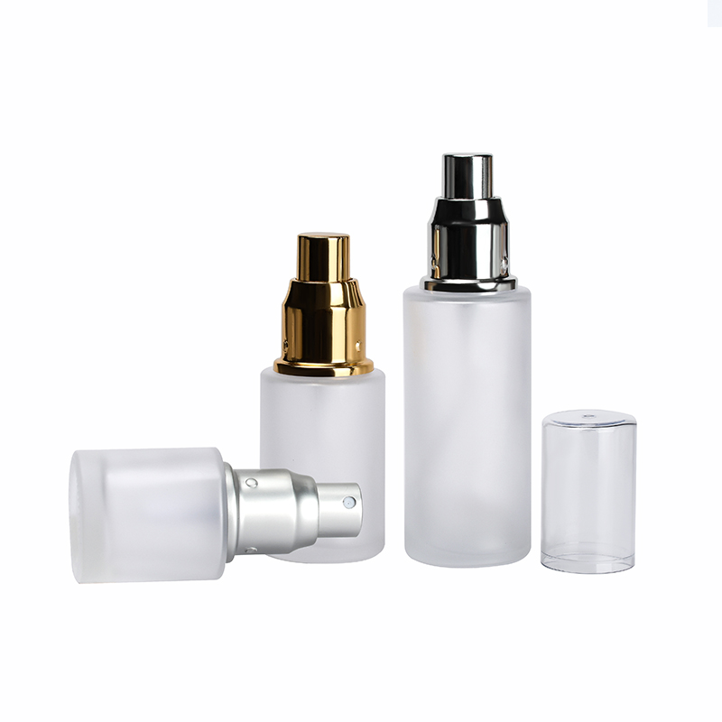 Skin care packaging 30ml 50ml 60ml 100ml 120ml clear frosted flat shoulder glass bottle with gold sliver aluminum sprayer cap