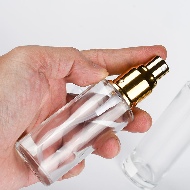 Skin care packaging 30ml 50ml 60ml 100ml 120ml clear frosted flat shoulder glass bottle with gold sliver aluminum sprayer cap