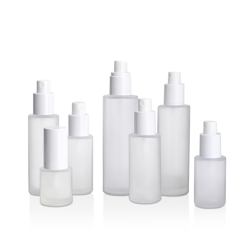 Skin care packaging 30ml 50ml 60ml 100ml 120ml clear frosted flat shoulder glass bottle with gold sliver aluminum sprayer cap